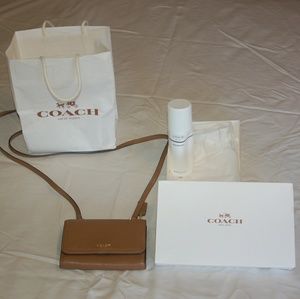 coach leather phone crossbody in saddle